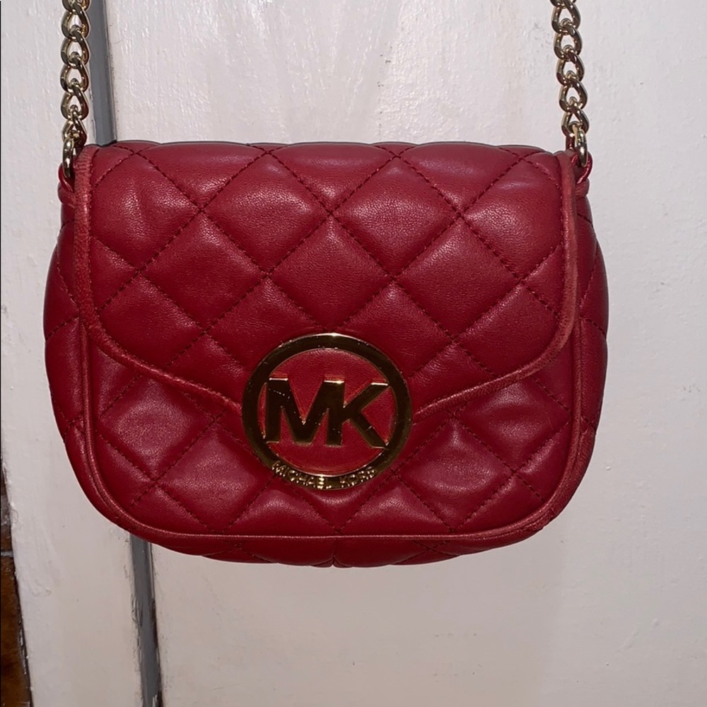 Red and gold micheal kors bag